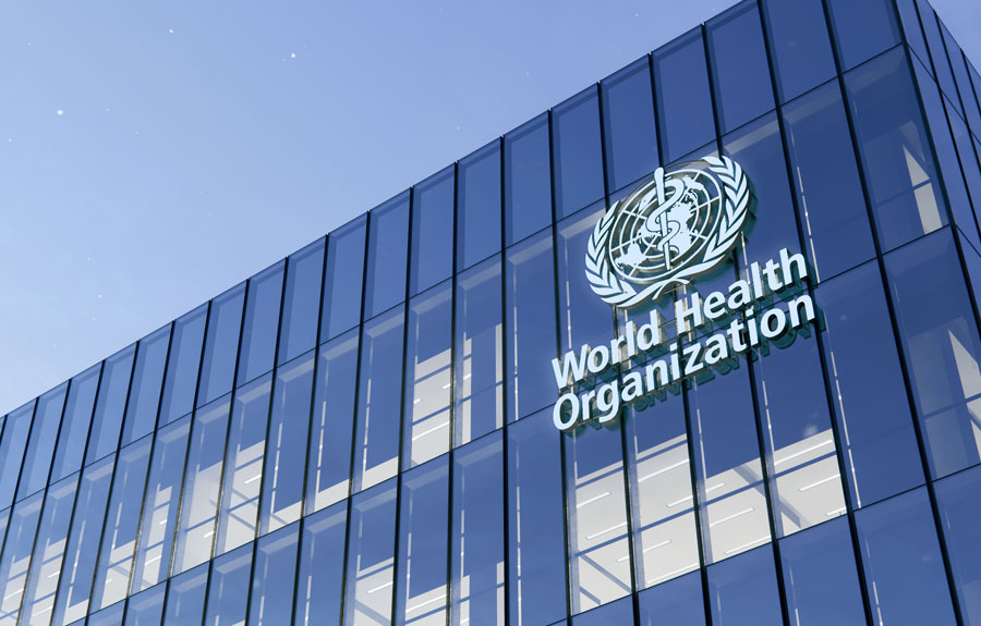 World Health Organization Signage Logo on Top of Glass Building. Workplace in High-rise Office Headquarter at Night Time. June 15, 2020. Editorial credit: askarim / Shutterstock.com, licensed.