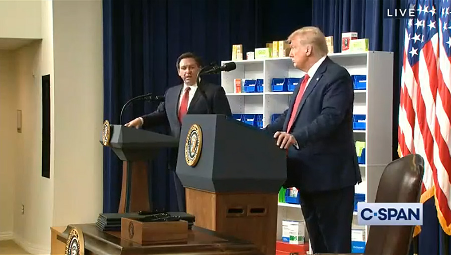 President Donald Trump speaks to Florida Gov. Ron DeSantis during an executive order signing ceremony on lowering drug prices on July 24. Trump announced new policies aimed at lowering prescription drug prices under Medicare by linking them to rates paid in other countries and allowing Americans to buy prescription medication imported from Canada. 