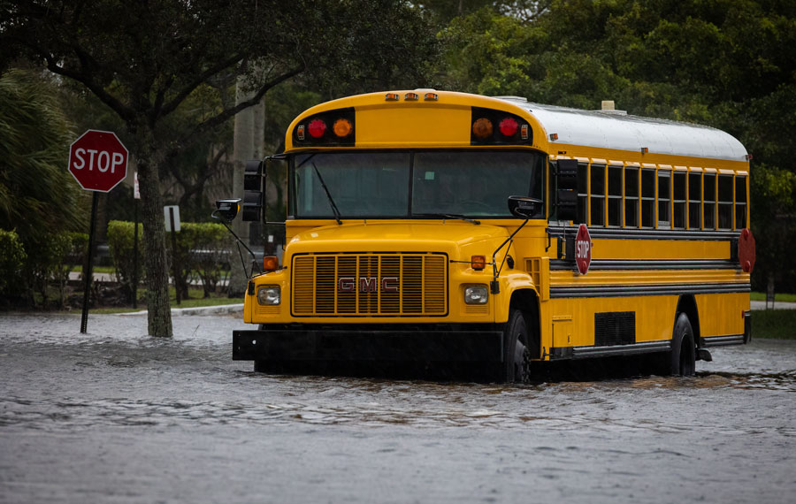 School Buses stuck in water during Hurricane Eta at Florida. Street Flood. Coral Springs, Florida. November 08, 2020. Editorial credit: YES Market Media / Shutterstock.com, licensed.