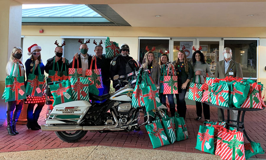 Members of Granny Nannies, FCSO, and other organizations dropping off the gift bags to Grand Oaks.