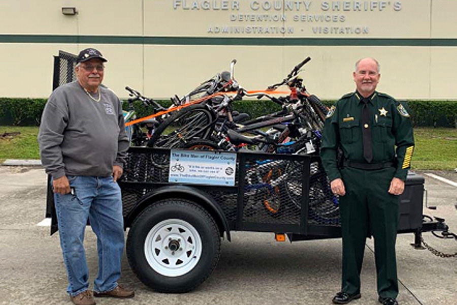 Joe Golan, Founder of the Bike Men of Flagler County, with Flagler County Sheriff Staly.