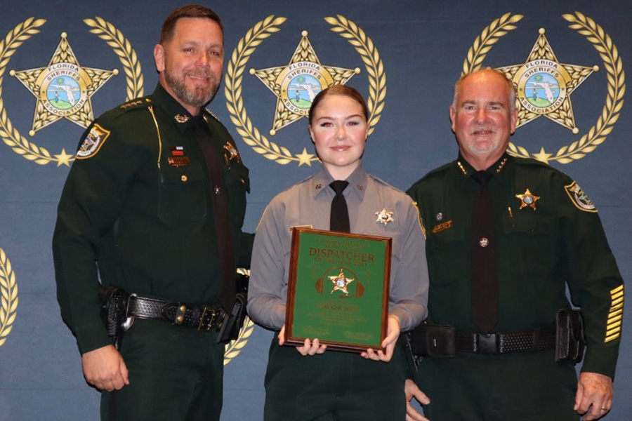 From left to right: FSA President and Gilchrist County Sheriff Bobby Schultz, FCSO Communications Specialist McKenzie Davis, and Sheriff Rick Staly.