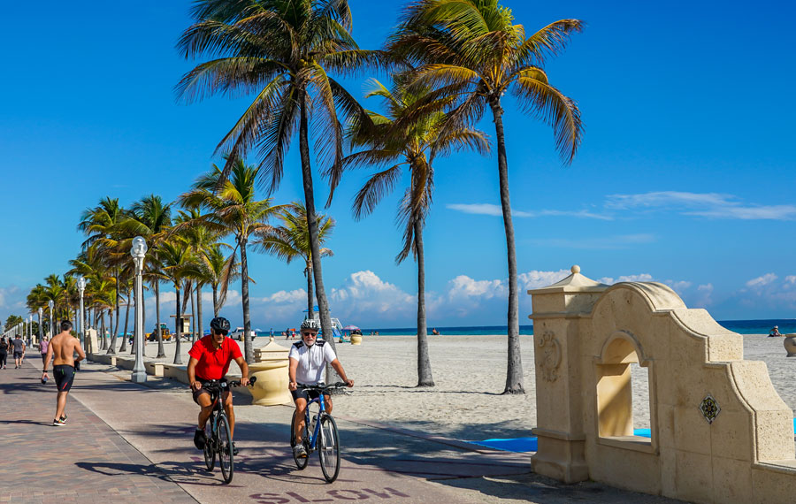 Bicycle riders and pedestrians in Broward County at the Hollywood Beach Boardwalk in South Florida, January 29, 2020. 