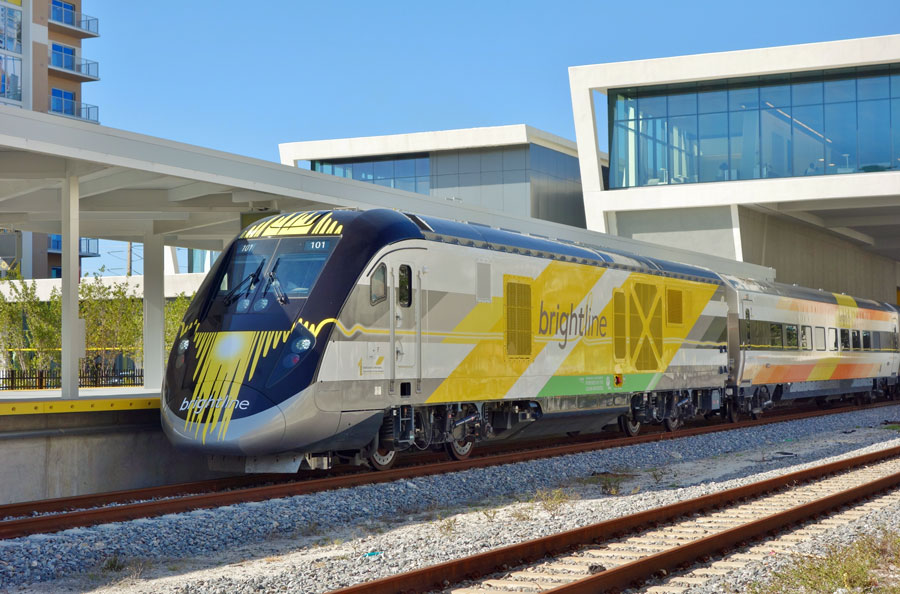 View of the Brightline train, a diesel–electric higher-speed rail system, at the West Palm Beach rail station in West Palm Beach, Florida. Brightline has stations at Miami, Fort Lauderdale and West Palm. March 2018. Editorial credit: EQRoy / Shutterstock.com, licensed.