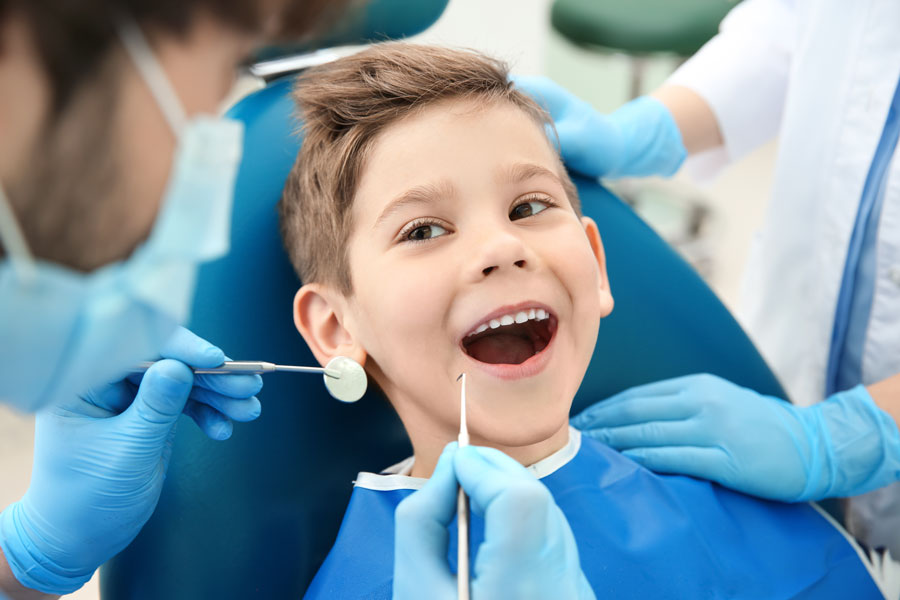 During National Children's Dental Health Month, dentists remind folks how important it is to keep a regular preventive care schedule, but recommend avoiding non-emergency care wherever community spread of the coronavirus is high or uncontrolled.