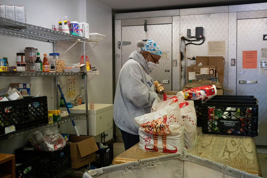 A volunteer prepares food packages for distribution at the Center for Food Action in Englewood, New Jersey, on March 9.