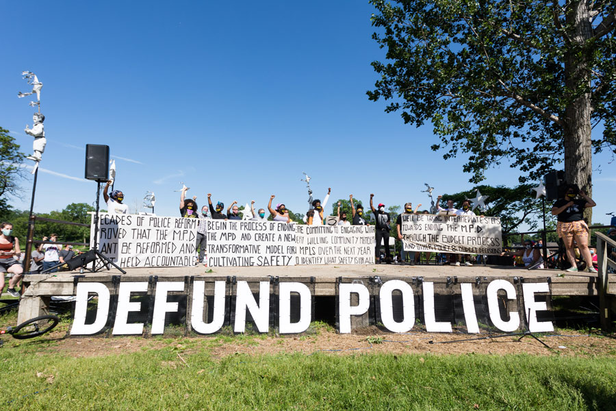 Members of the Black Visions Collective and Reclaim the Block hold banners outlining the City Council’s plan to dismantle the police department. Minneapolis, MN, June 7, 2020. 