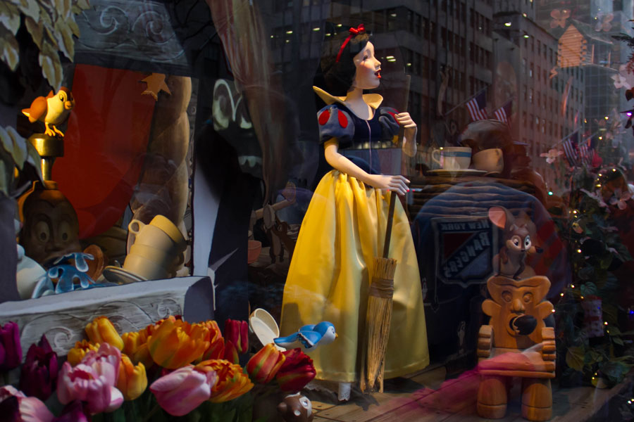 Snow white with a broom in Saks Fifth Avenue’s holiday window display; In celebration of the 80th anniversary of Disney's Snow White and the Seven Dwarfs. Manhattan, New York, December 20, 2017 Editorial credit: Spinel / Shutterstock.com, licensed.