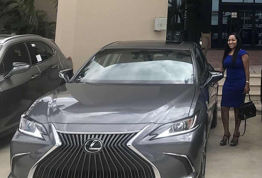 Fort Lauderdale local Michelle Smith, winner of the annual car giveaway, with the new 2021 Lexus ES 350.