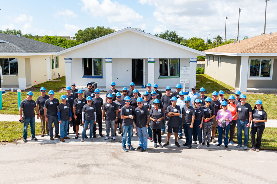 South Florida CEOs in front of new Habitat homes they landscaped during Habitat Broward’s 2nd annual CEO Build.