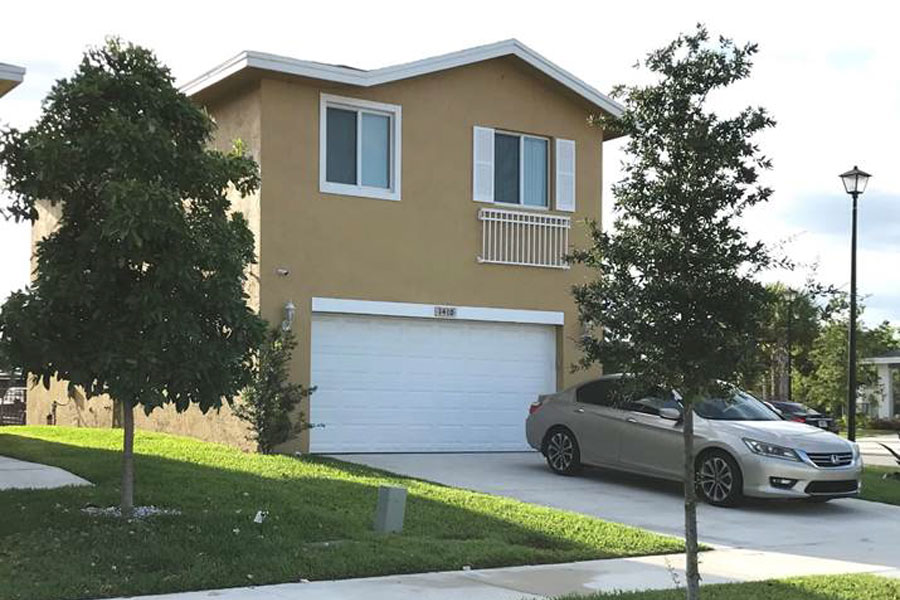 A two-story Habitat home in Pompano Beach. The new energy efficient models will include garages, landscaped yards, four bedrooms, hurricane windows, and modern kitchens.