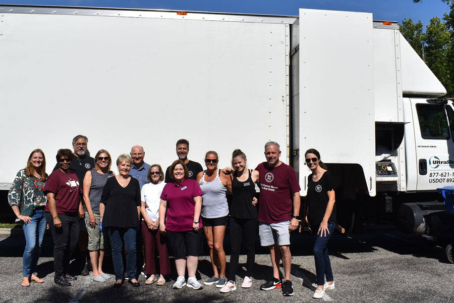 The food items and monetary donations were collected during community shredding events at the company’s branch offices in Fleming Island, Mandarin and MuraBella at World Golf Village.