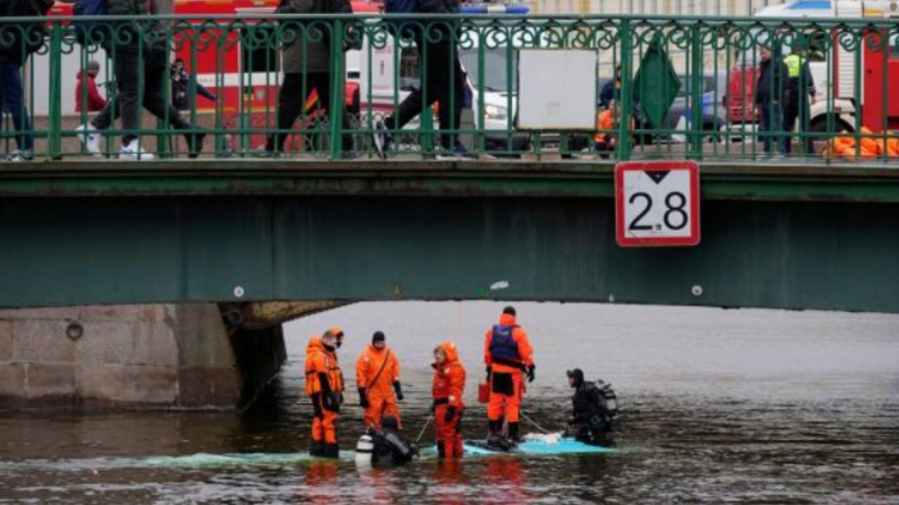 A bus plunges off a bridge in Russia