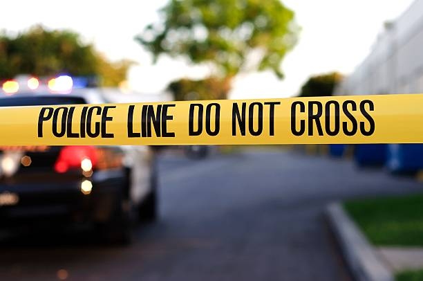 @LakelandWatch – Photo taken at 7:00 PM, shows crime scene tape near driveway