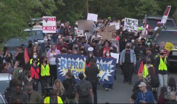 @LocalVoice – Taken 4:10 PM outside courthouse, protesters holding